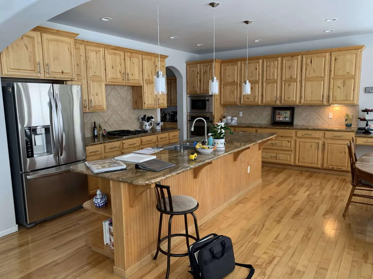 Before — Honey-toned wood to crisp white, navy island
