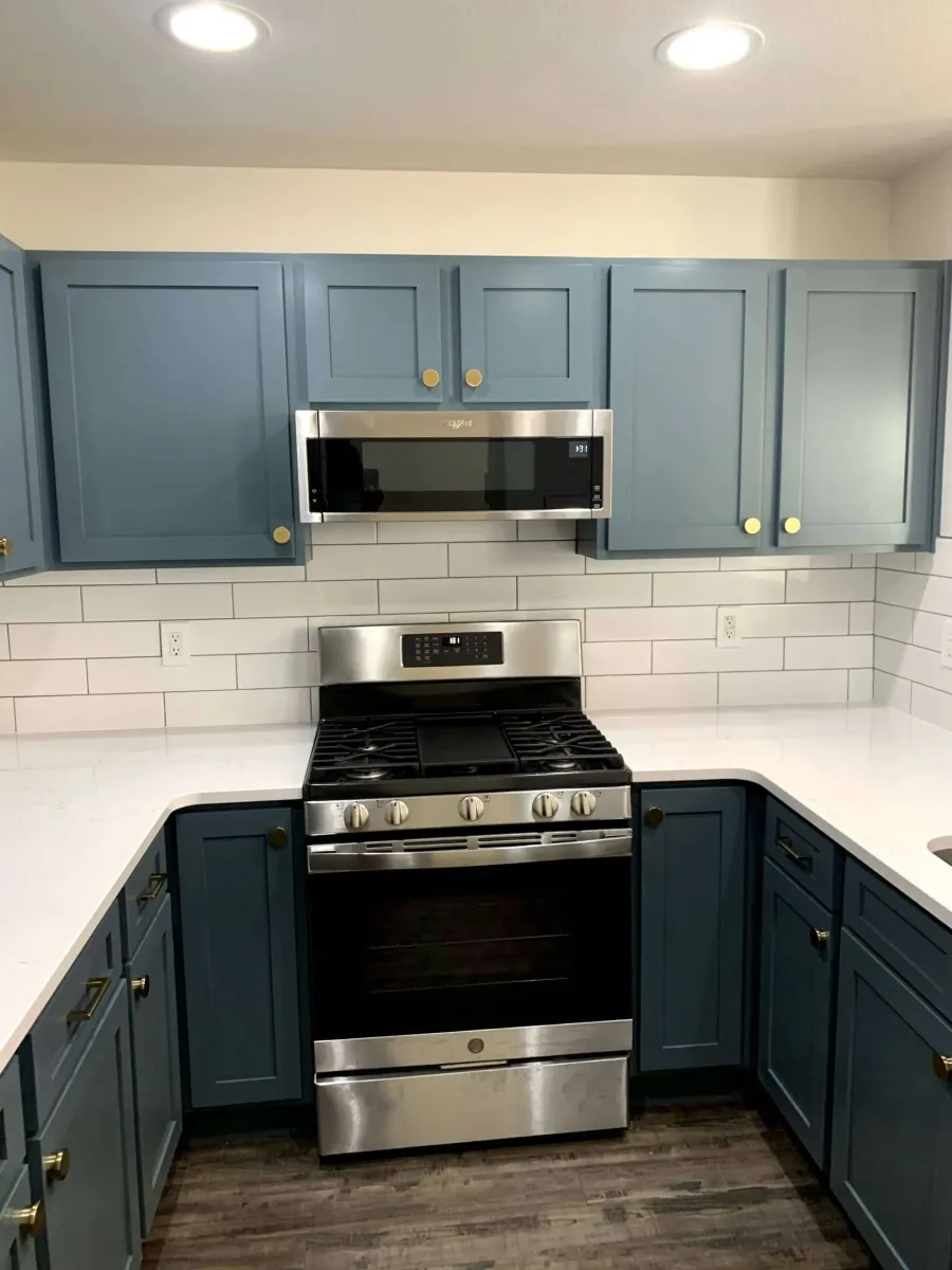 After — Dark cherry tones to slate blue, brass hardware